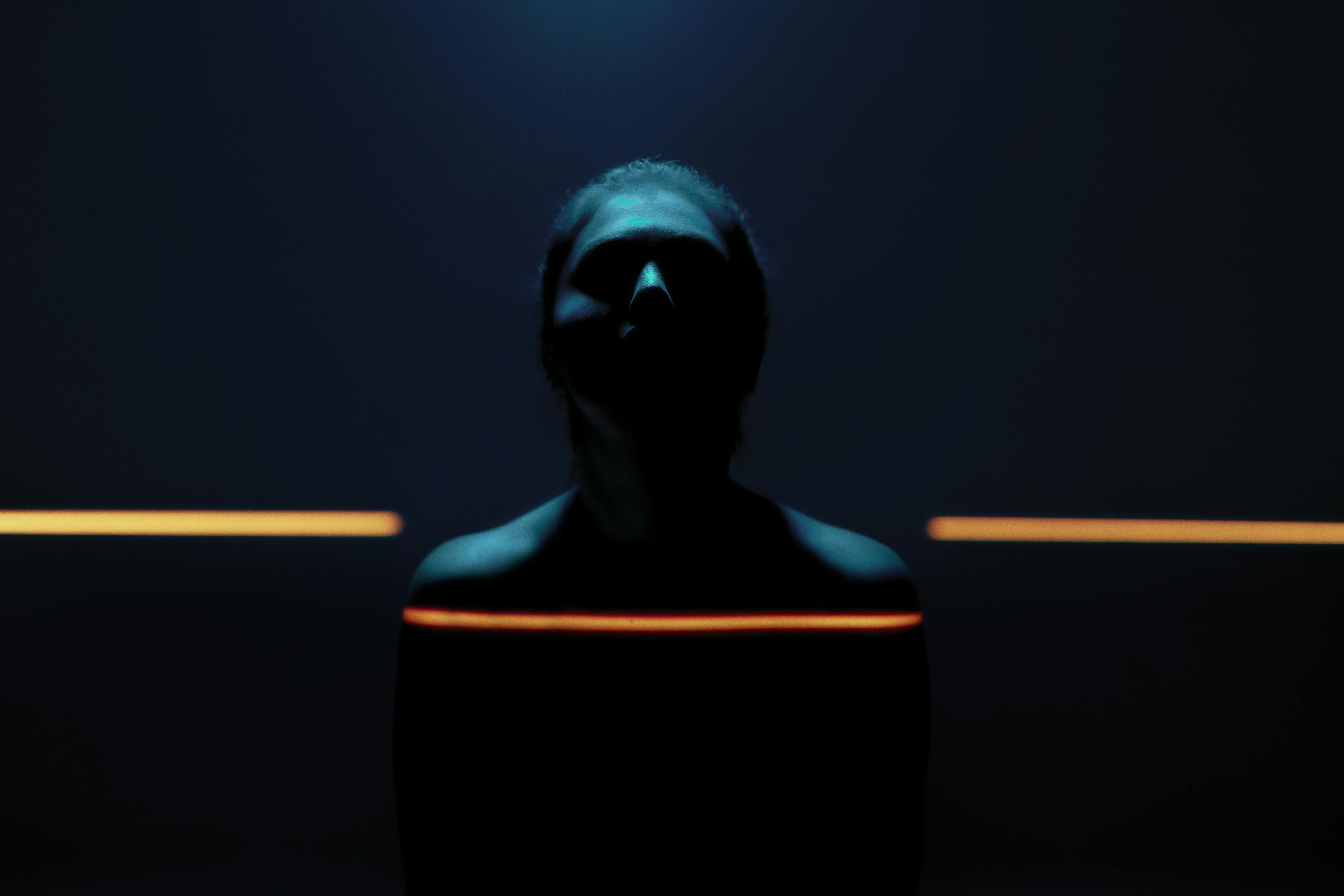 A glowing line art of a human spine showing flexibility