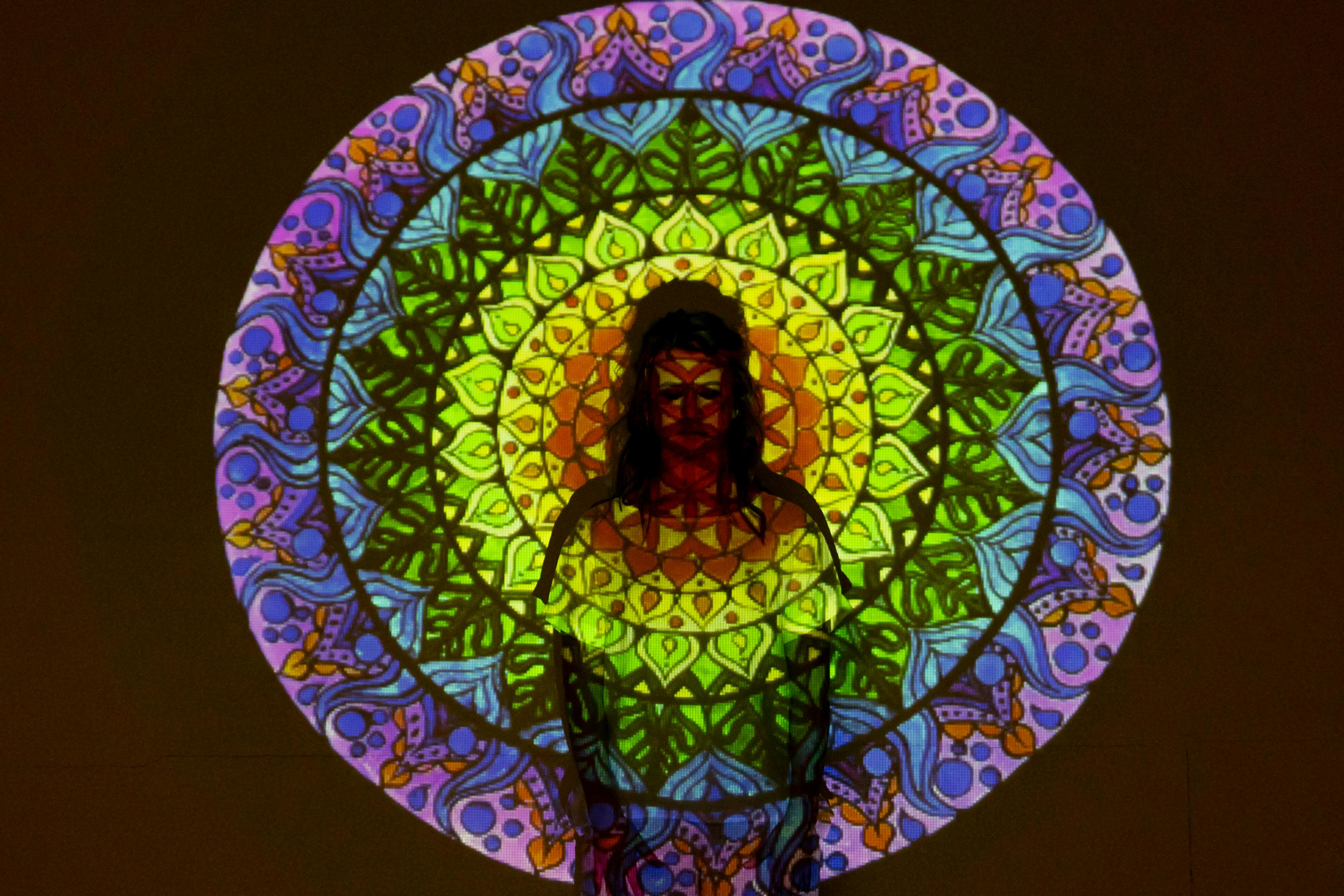 Woman silhouette in a yoga pose with azure light outlines